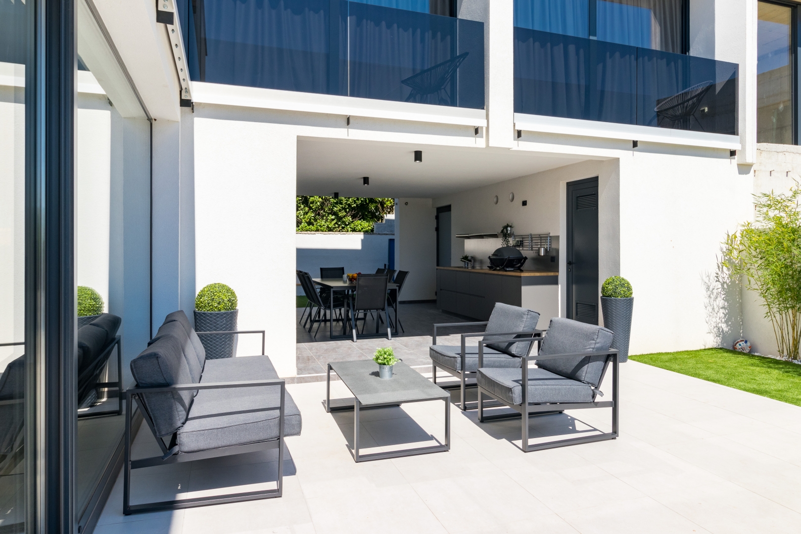 Covered outdoor lounge and dining terrace