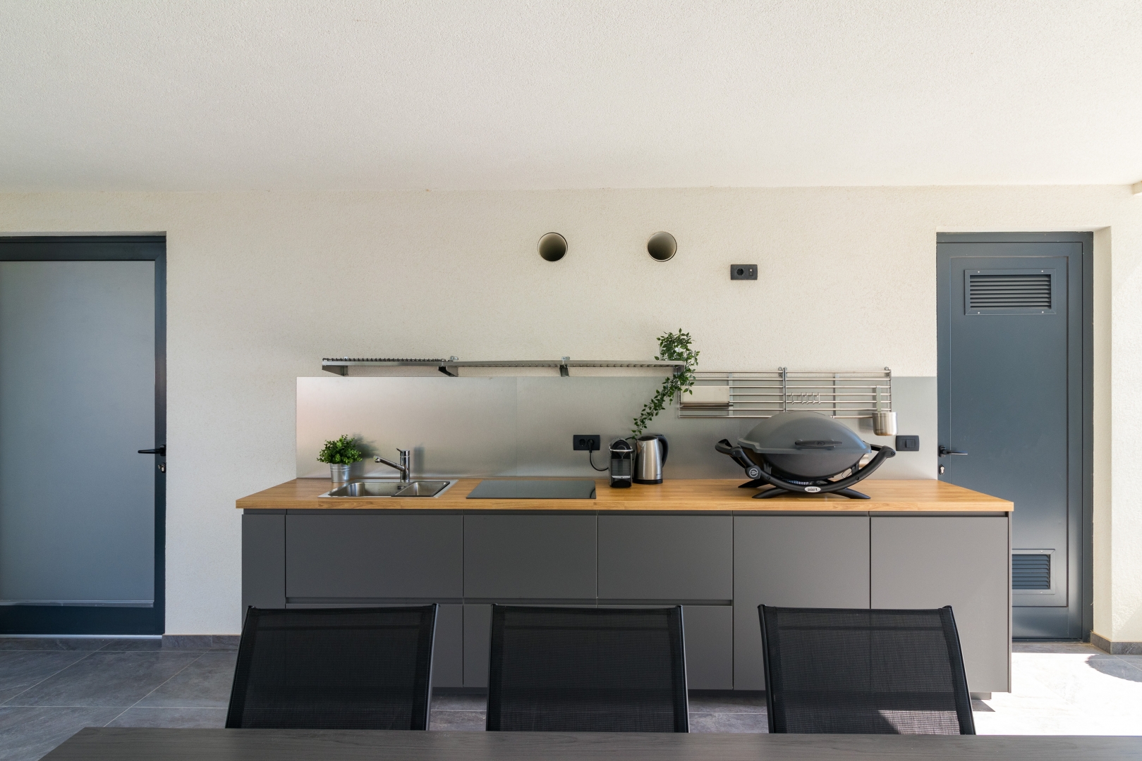 Outdoor kitchen with grill and sink