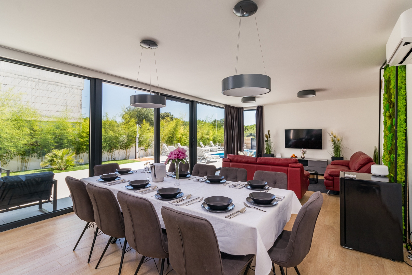 Open-plan living and dining area with garden view